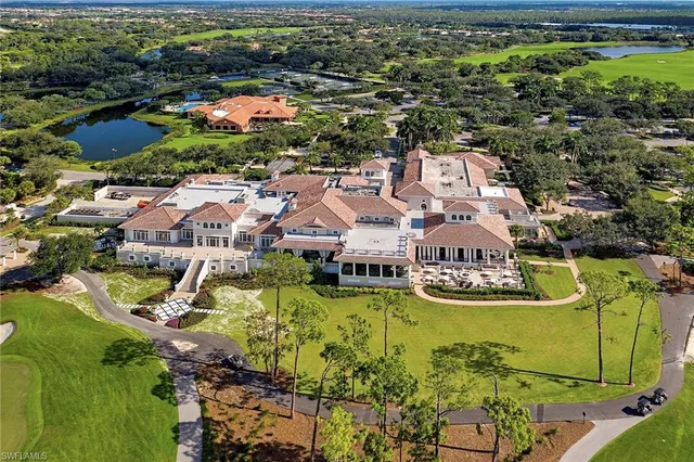 a dining room with lots of furniture and chandelier