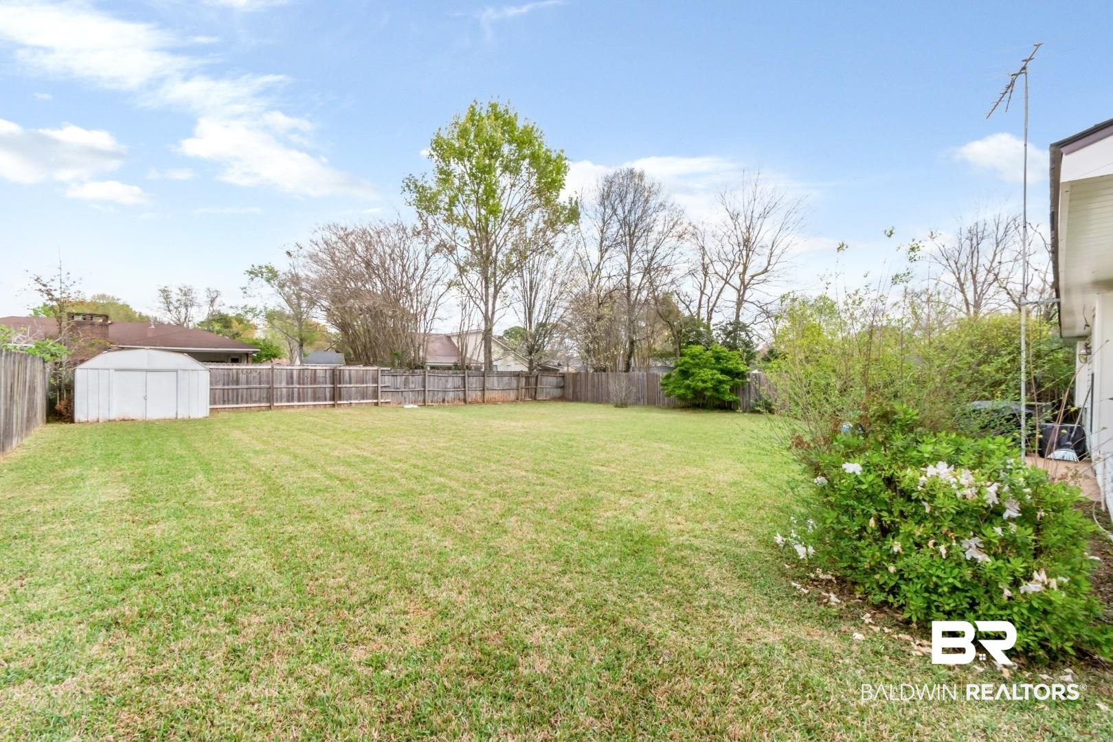 6208 Cottage Hill Road Mobile, AL 36609 - Photo 18 of 20 Fenced backyard with a storage shed