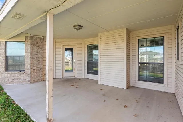 a view of a brick house with a outdoor space