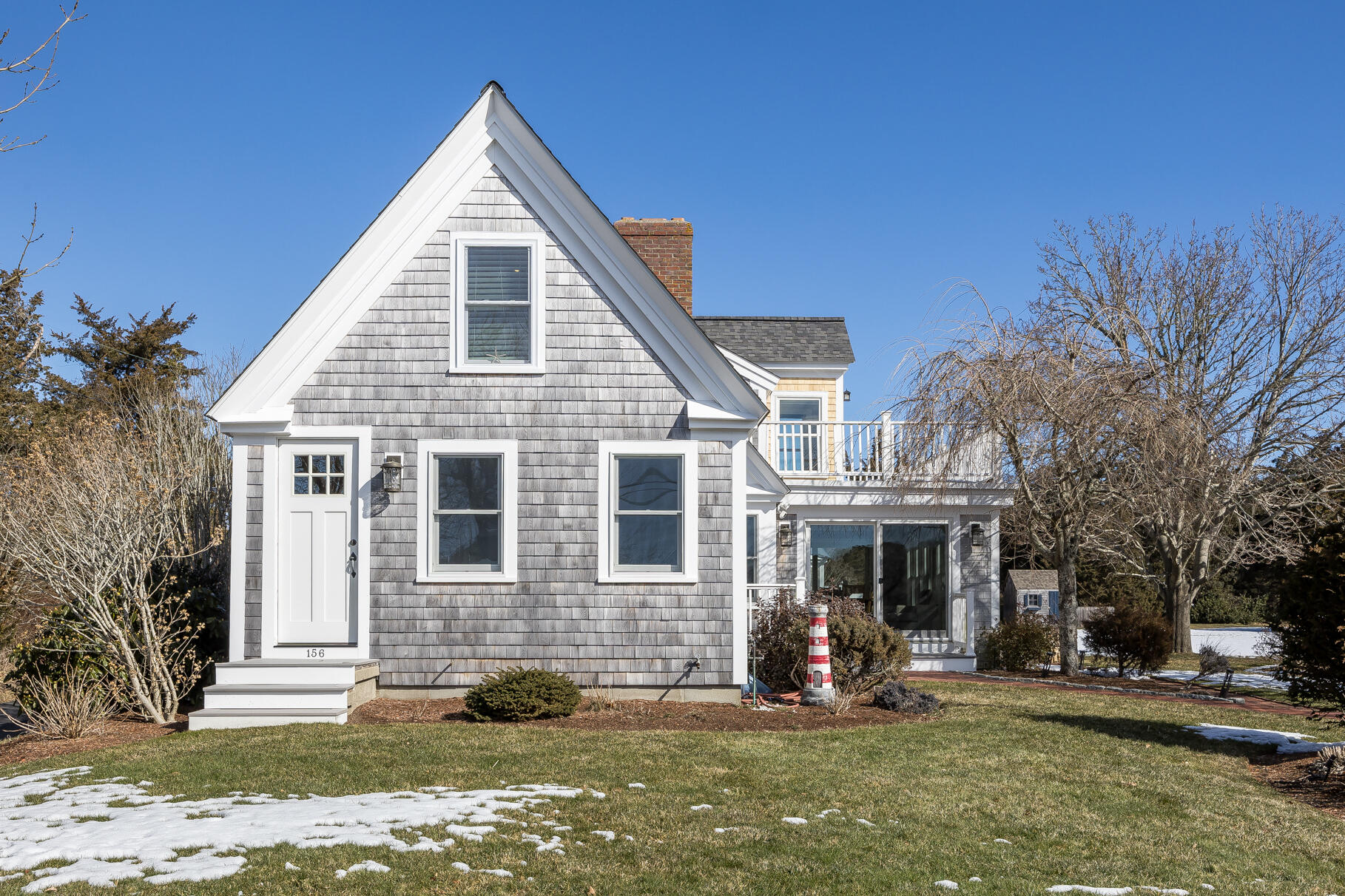 156 Commerce Road Barnstable, MA 02630 - Photo 4 of 54 a front view of a house with garden