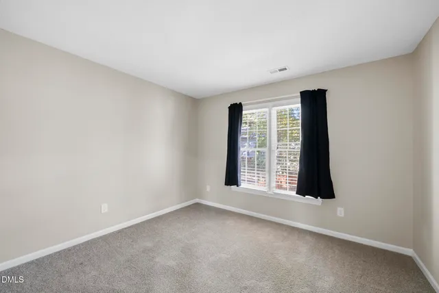 an empty room with large window