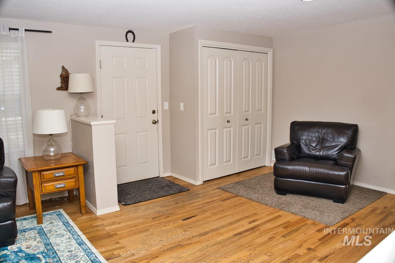 2223 West Spaulding Street Boise, ID 83705 - Photo 13 of 50 Living area featuring light wood-style flooring and baseboards