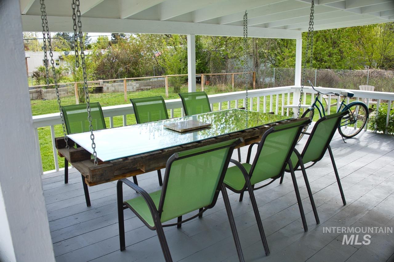 2223 West Spaulding Street Boise, ID 83705 - Photo 33 of 50 Fenced backyard featuring a wooden deck and outdoor dining space