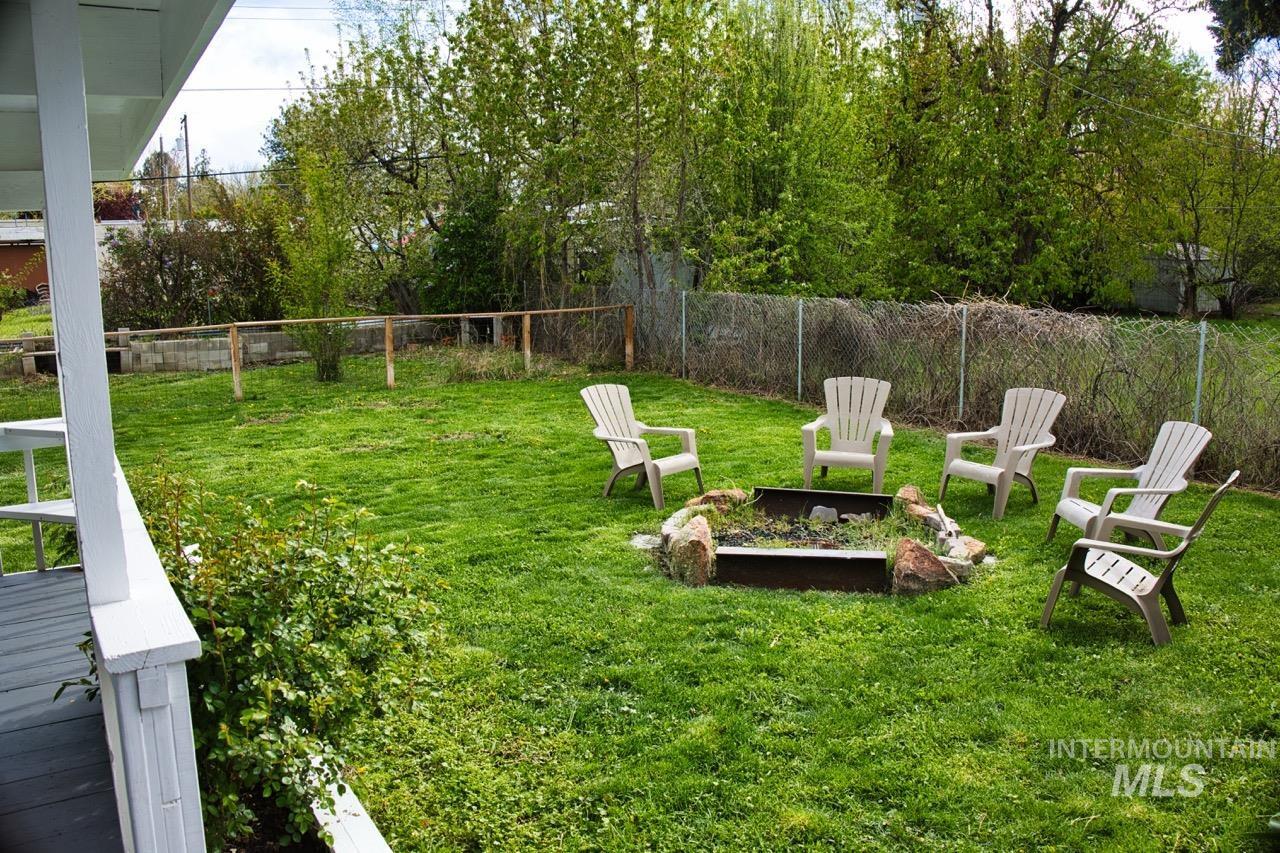 2223 West Spaulding Street Boise, ID 83705 - Photo 40 of 50 Fenced backyard with an outdoor fire pit