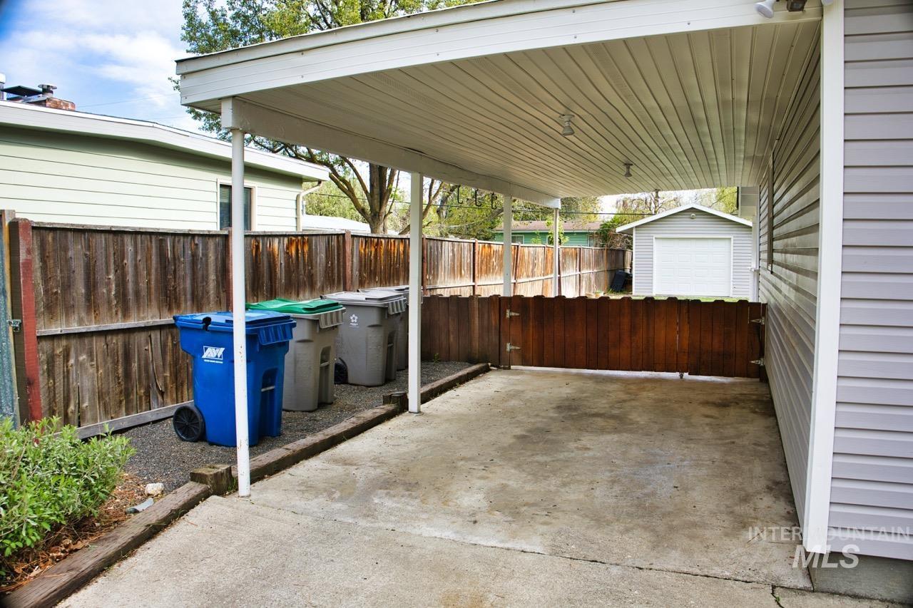 2223 West Spaulding Street Boise, ID 83705 - Photo 6 of 50 Fenced backyard with a patio area and a storage shed