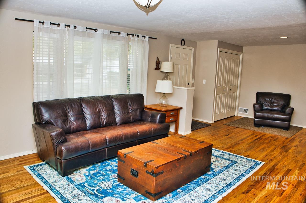 2223 West Spaulding Street Boise, ID 83705 - Photo 8 of 50 Living area with wood finished floors and a textured ceiling