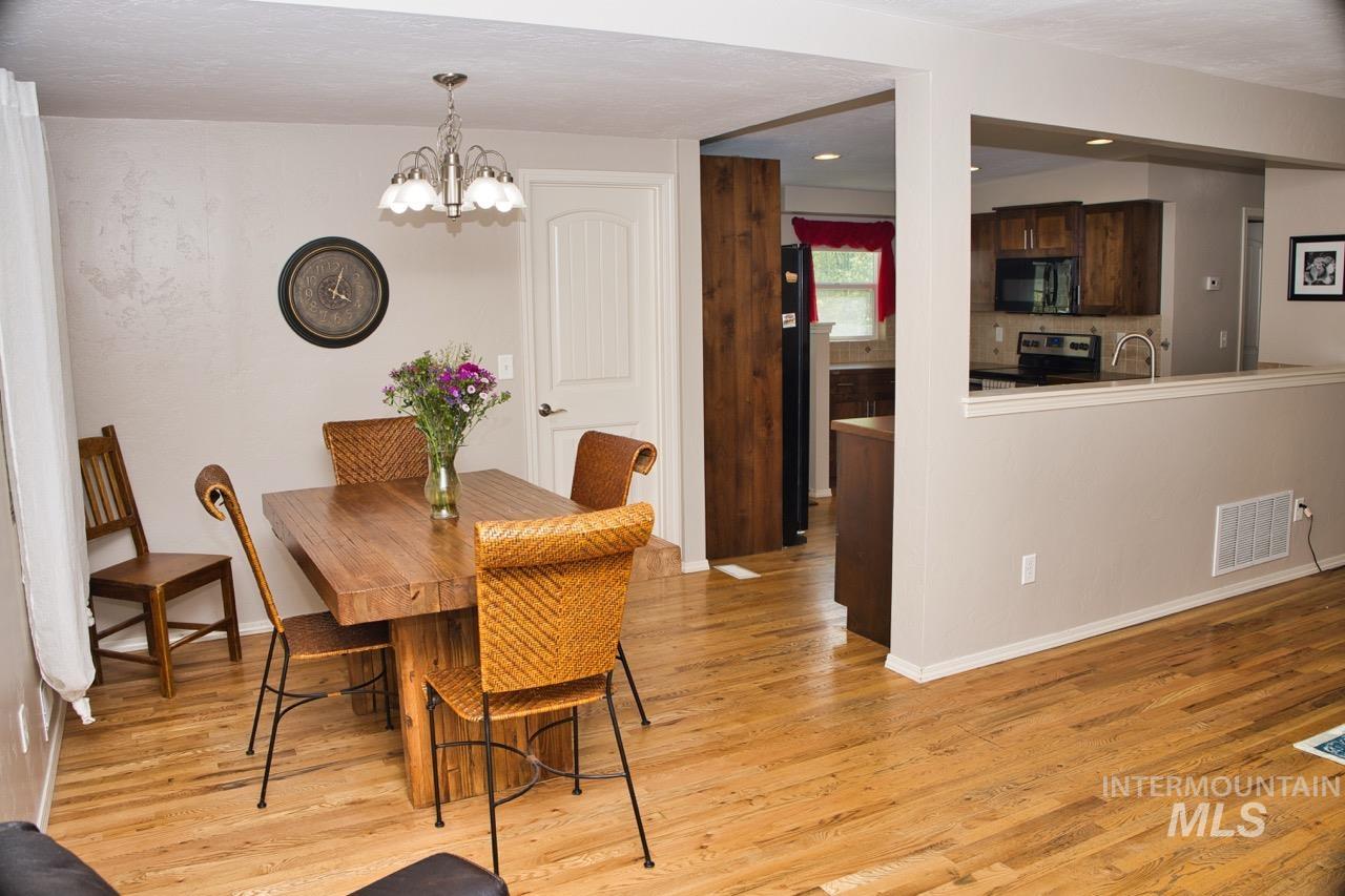 2223 West Spaulding Street Boise, ID 83705 - Photo 9 of 50 Dining room featuring suspended lighting and light wood-style flooring