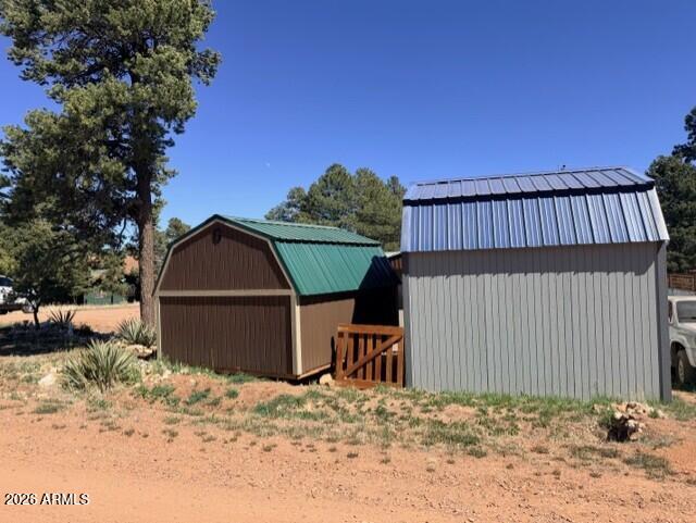 2019 Broken Arrow Road Overgaard, AZ 85933 - Photo 14 of 19 a view of a backyard of a house