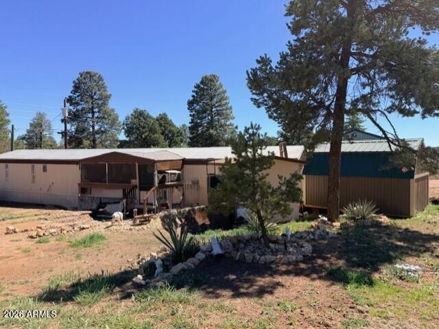 2019 Broken Arrow Road Overgaard, AZ 85933 - Photo 16 of 19 a view of patio with a yard