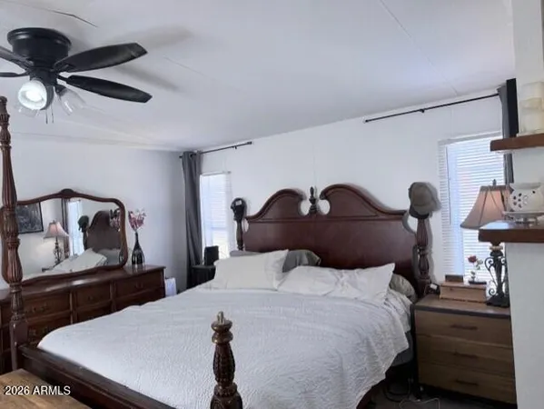 a bedroom with a bed and dresser