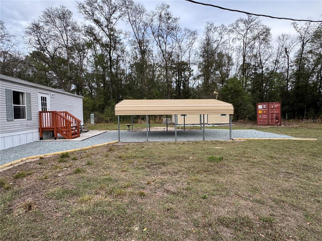 4317 284th Street Branford, FL 32008 - Photo 11 of 45 a view of a house with backyard and sitting area