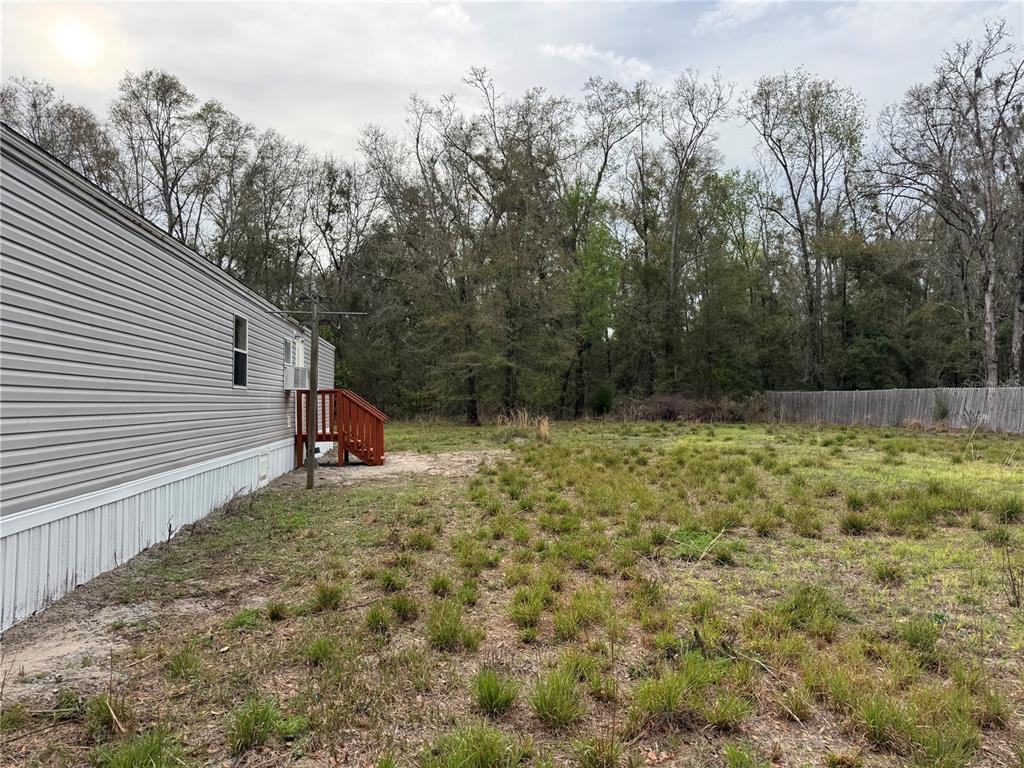4317 284th Street Branford, FL 32008 - Photo 22 of 45 a backyard of a house with lots of green space