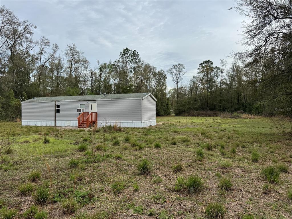 4317 284th Street Branford, FL 32008 - Photo 23 of 45 a backyard of a house with lots of green space