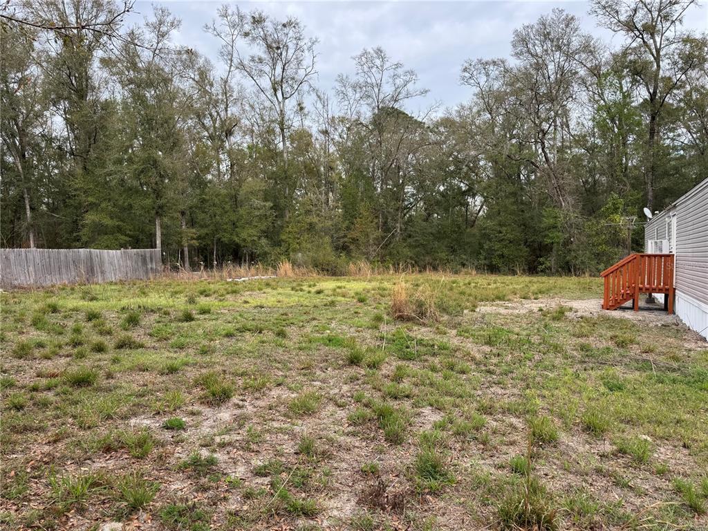 4317 284th Street Branford, FL 32008 - Photo 26 of 45 a backyard of a house with lots of green space