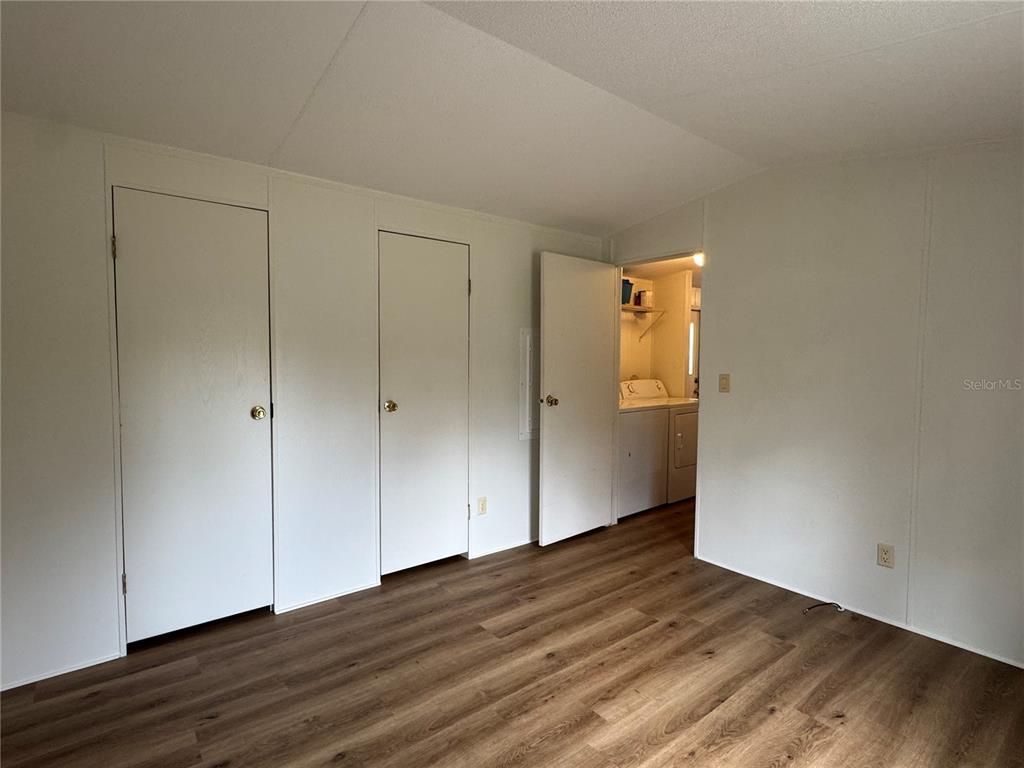 4317 284th Street Branford, FL 32008 - Photo 38 of 45 a view of an empty room with wooden floor and a window