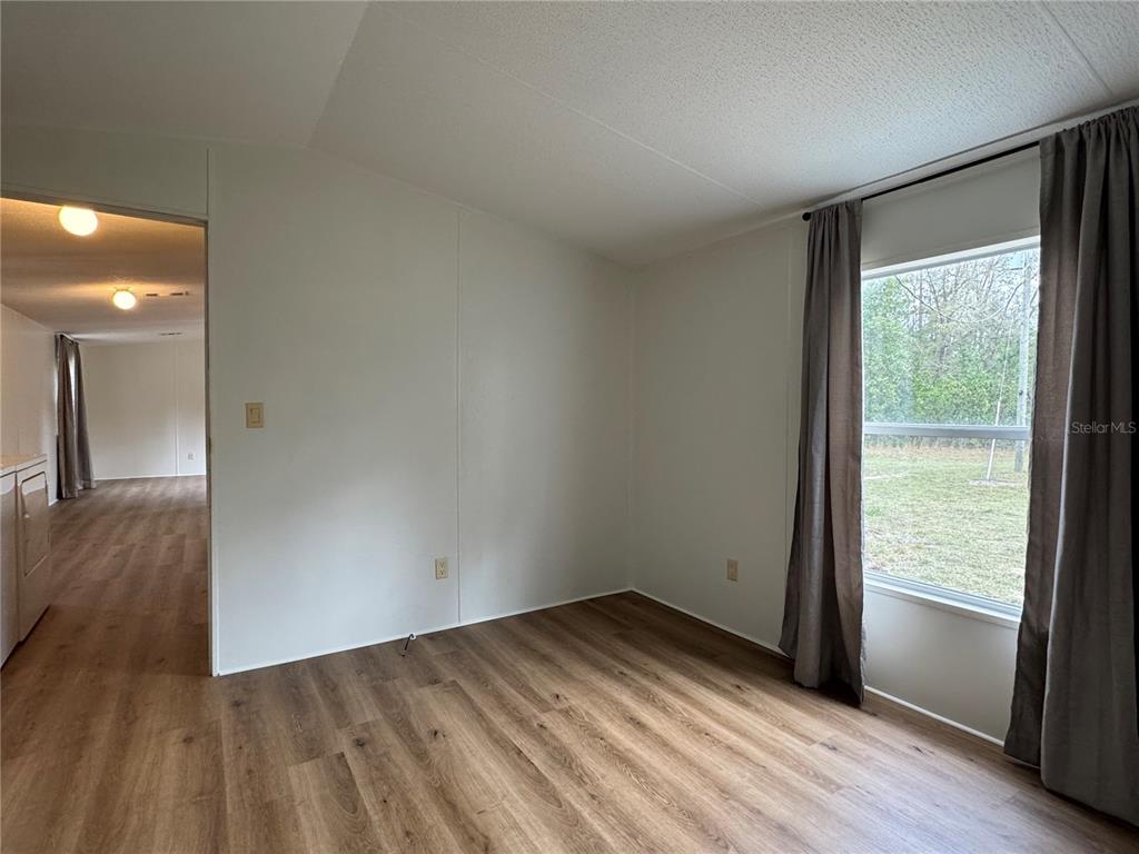 4317 284th Street Branford, FL 32008 - Photo 40 of 45 a view of empty room with wooden floor and fan