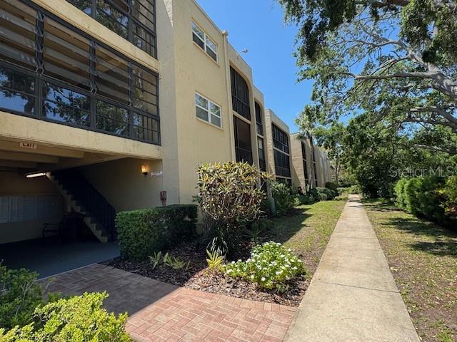 11485 Oakhurst Road, Unit 319 Largo, FL 33774 - Photo 36 of 63 a view of a pathway with a yard