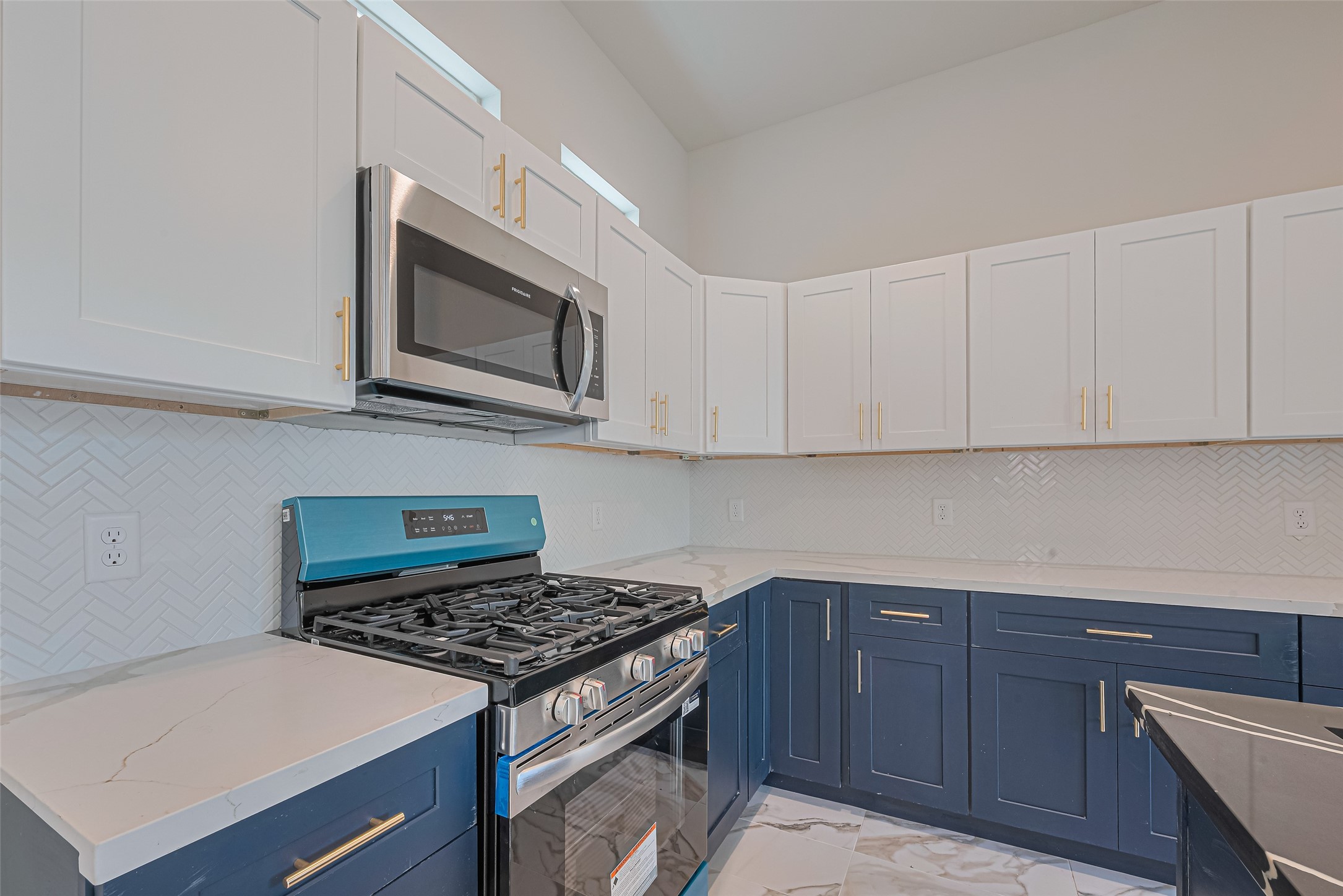 2414 Sam Wilson Street Houston, TX 77020 - Photo 10 of 29 a kitchen with stainless steel appliances granite countertop a stove and a microwave