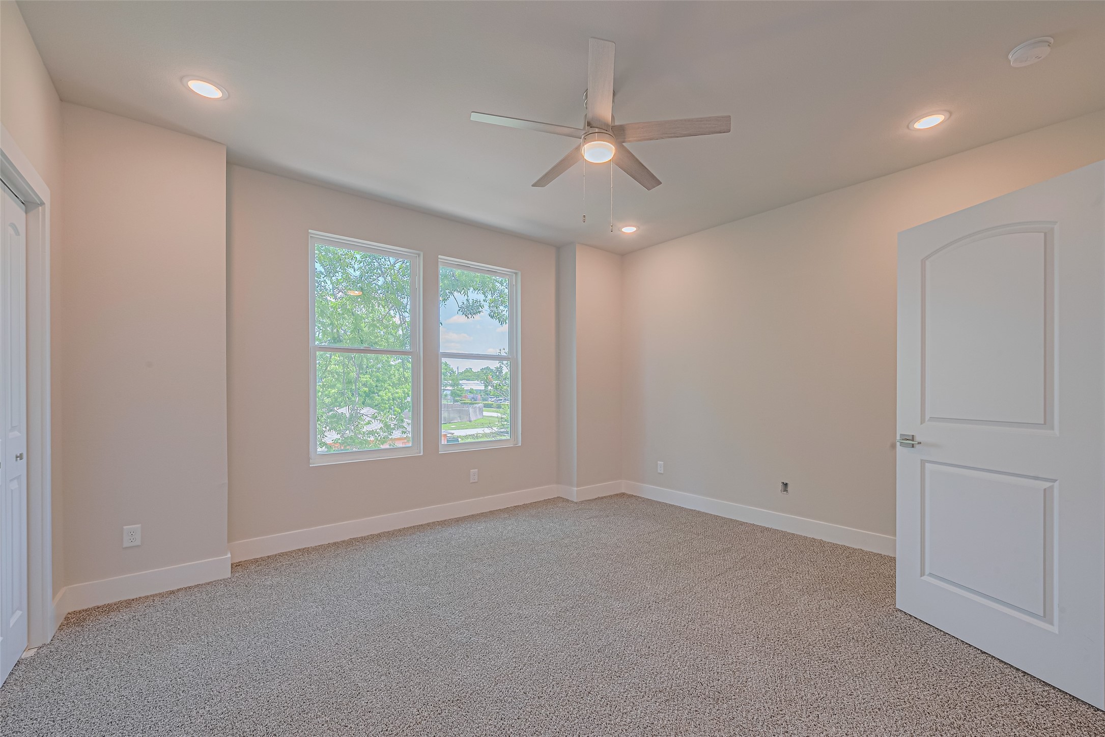 2414 Sam Wilson Street Houston, TX 77020 - Photo 14 of 29 an empty room with a window and a fan
