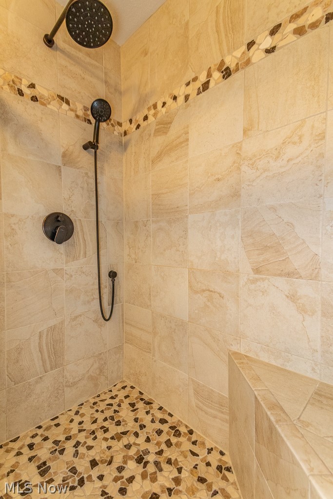 168 Burwick Road Cleveland, OH 44143 - Photo 14 of 31 Beautiful Owners Suite shower with newer tile and river rock floor.