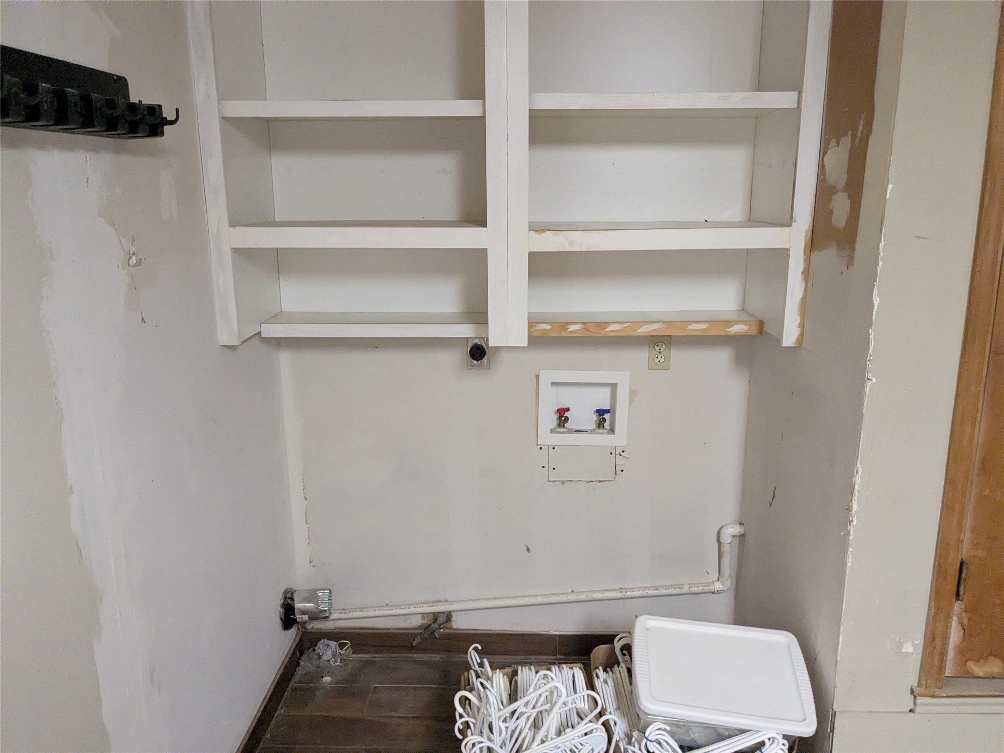 2502 Charla Circle Austin, TX 78728 - Photo 13 of 14 Functional laundry space featuring convenient shelving and hookups for appliances.