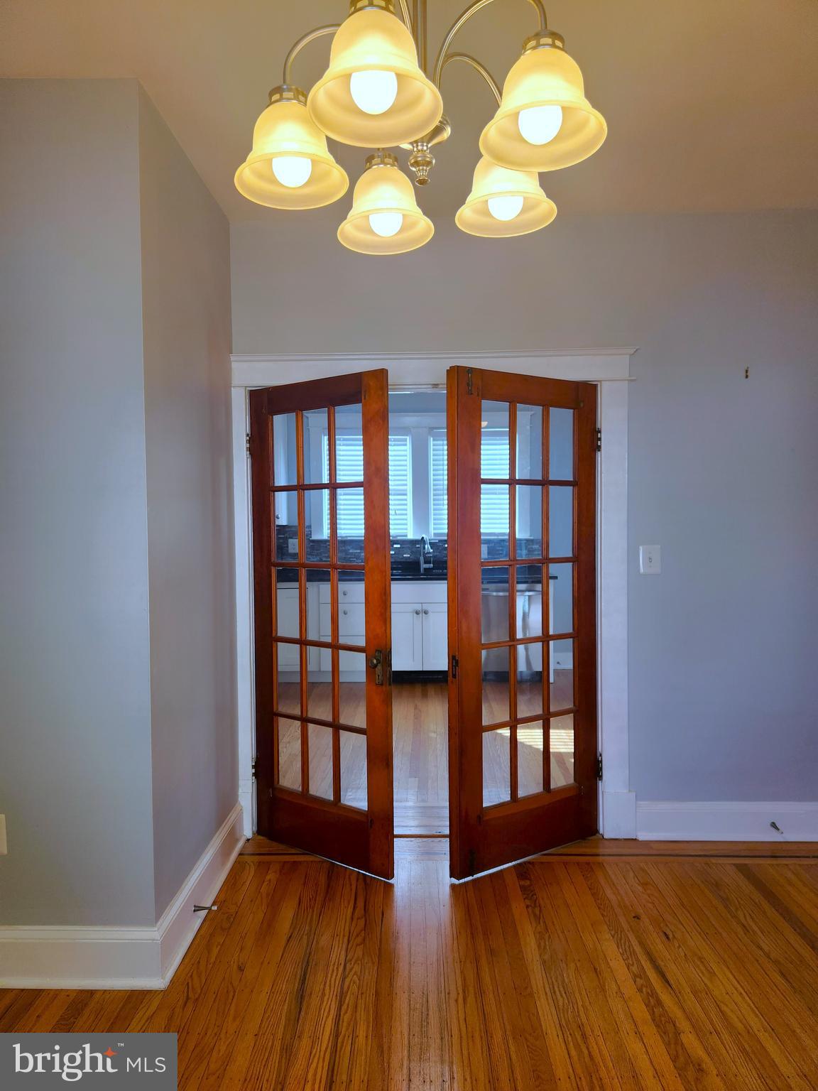 615 Old Home Road Baltimore, MD 21206 - Photo 11 of 31 a view of an empty room with wooden floor