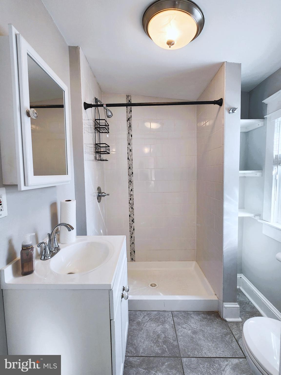 615 Old Home Road Baltimore, MD 21206 - Photo 16 of 31 a bathroom with a sink a toilet and shower