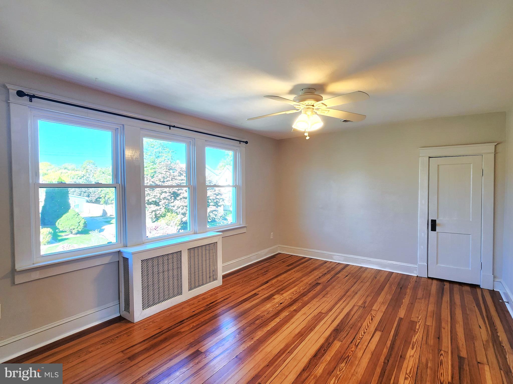 615 Old Home Road Baltimore, MD 21206 - Photo 18 of 31 a view of an empty room with window and wooden floor