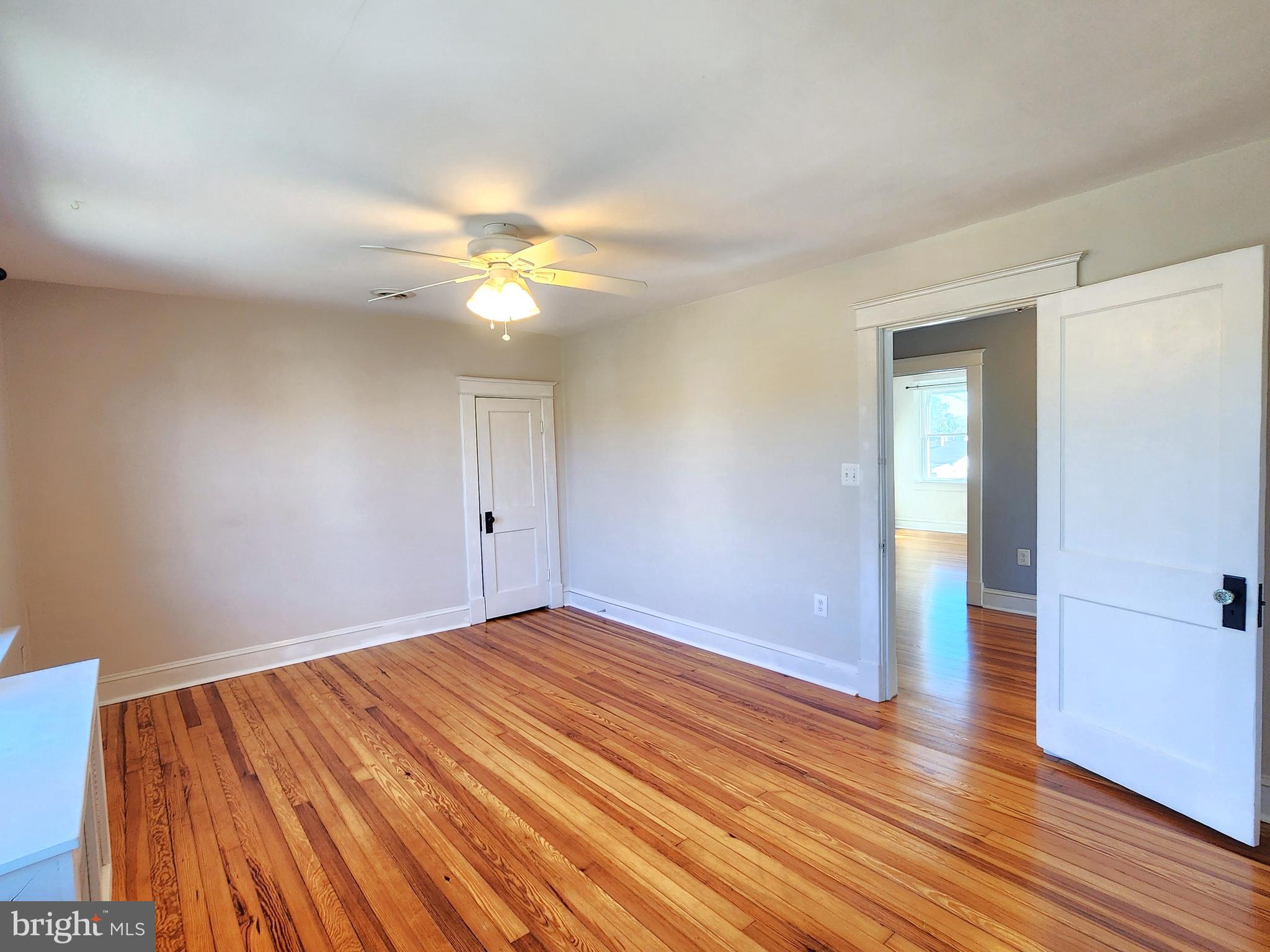 615 Old Home Road Baltimore, MD 21206 - Photo 19 of 31 a view of an empty room with wooden floor