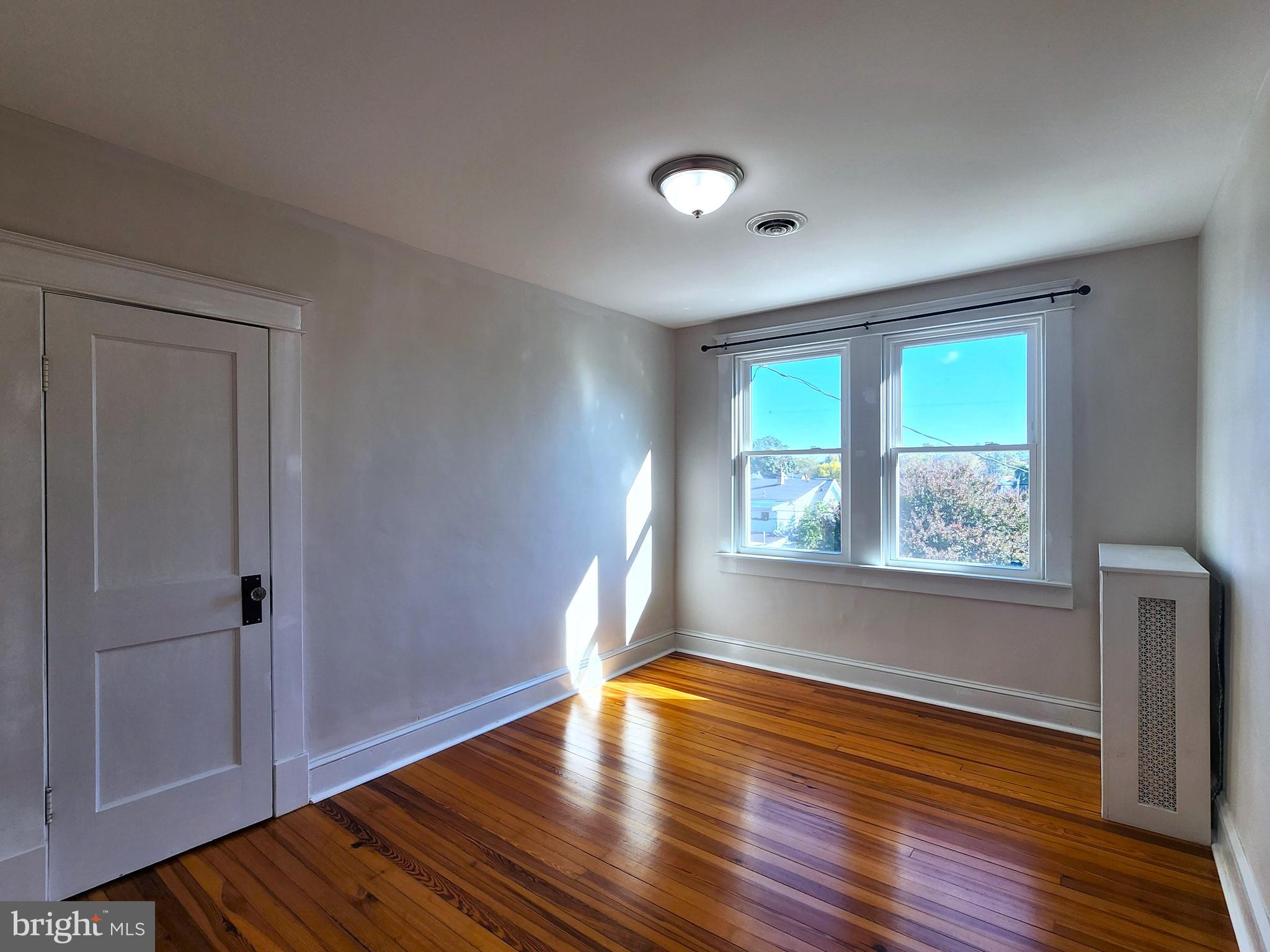 615 Old Home Road Baltimore, MD 21206 - Photo 21 of 31 a view of empty room with wooden floor and fan