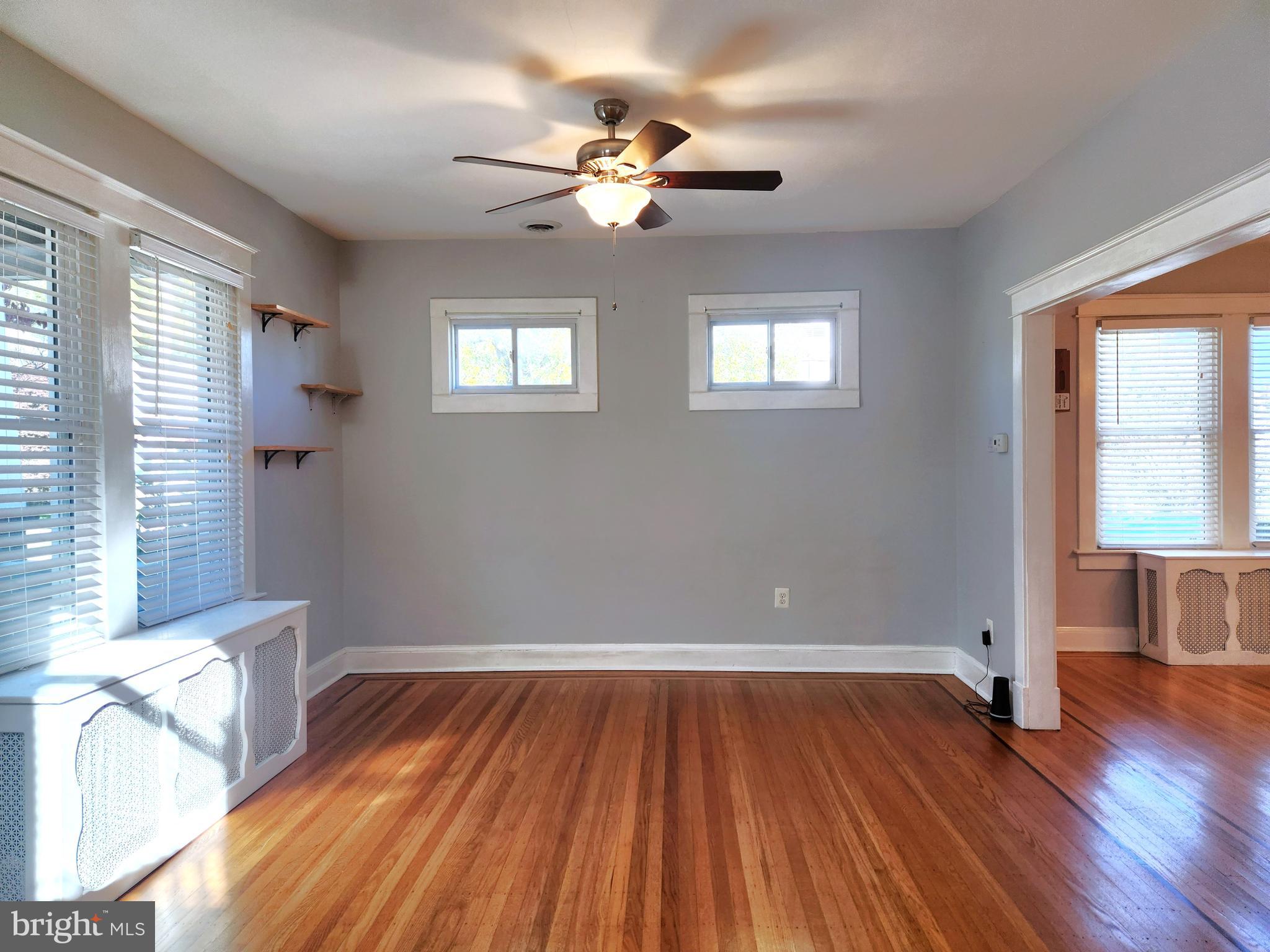 615 Old Home Road Baltimore, MD 21206 - Photo 9 of 31 wooden floor in an empty room with a window