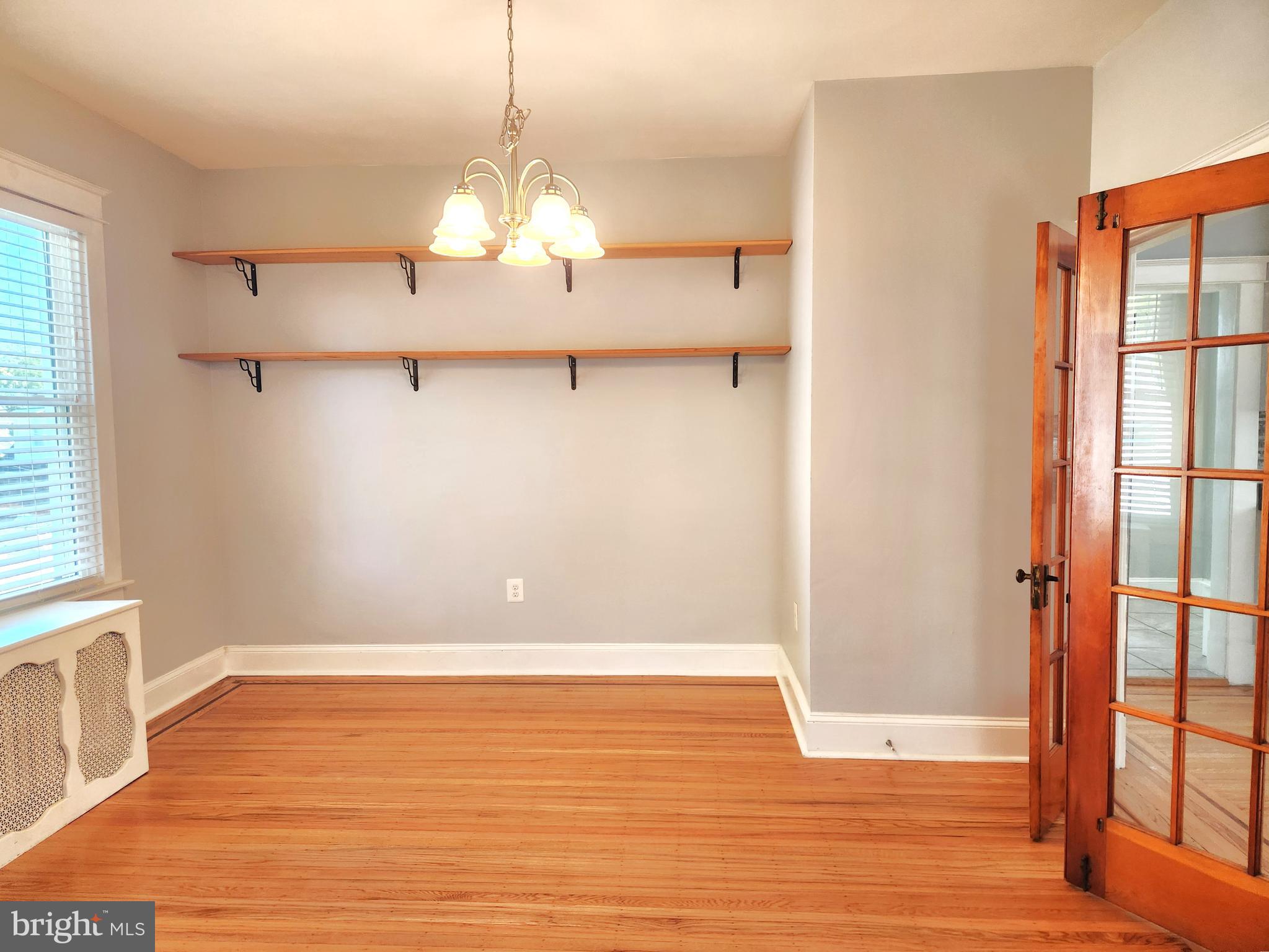 615 Old Home Road Baltimore, MD 21206 - Photo 10 of 31 a view of a room with wooden floor and large window