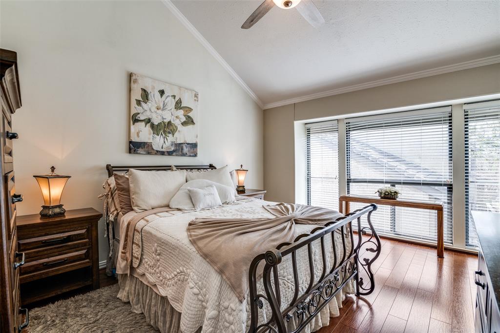 4559 North O'Connor Road, Unit 2289 Irving, TX 75062 - Photo 12 of 23 Primary bedroom 1st floor with vaulted ceiling, crown molding, wood finished floors, and a ceiling fan