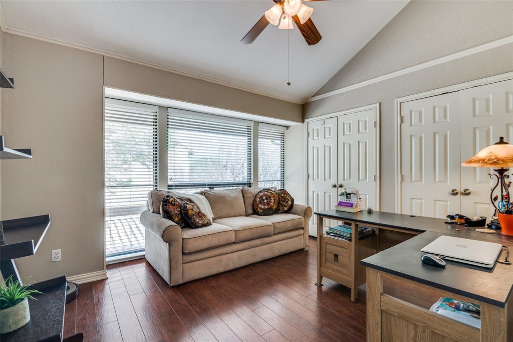 4559 North O'Connor Road, Unit 2289 Irving, TX 75062 - Photo 14 of 23 Second 1st floor bedroom currently used as an office. Double closet side by side. Vaulted ceiling, ceiling fan, dark wood finished floors, and baseboards