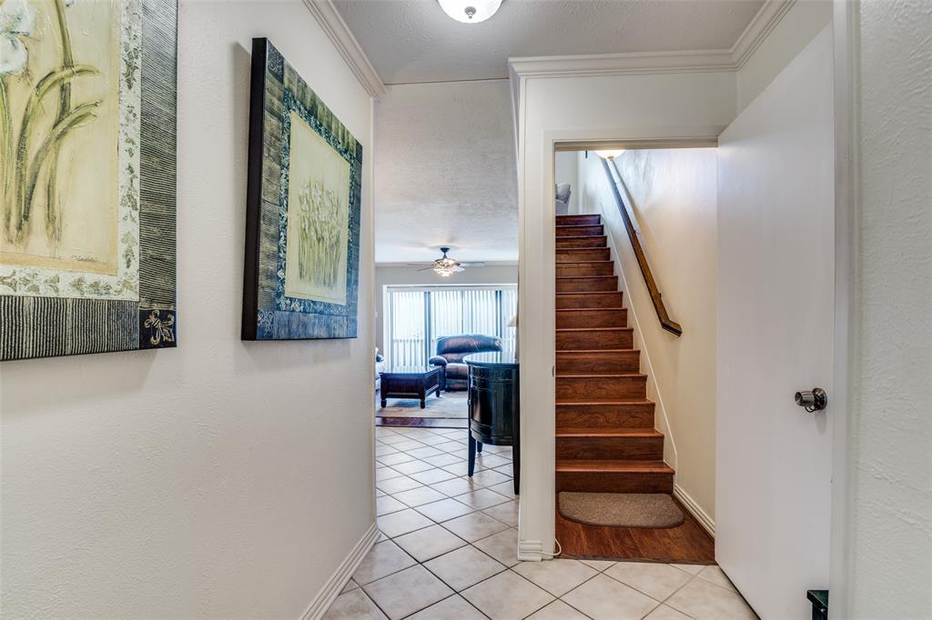 4559 North O'Connor Road, Unit 2289 Irving, TX 75062 - Photo 2 of 23 Stairs featuring tile patterned floors, baseboards, ornamental molding, and a ceiling fan
