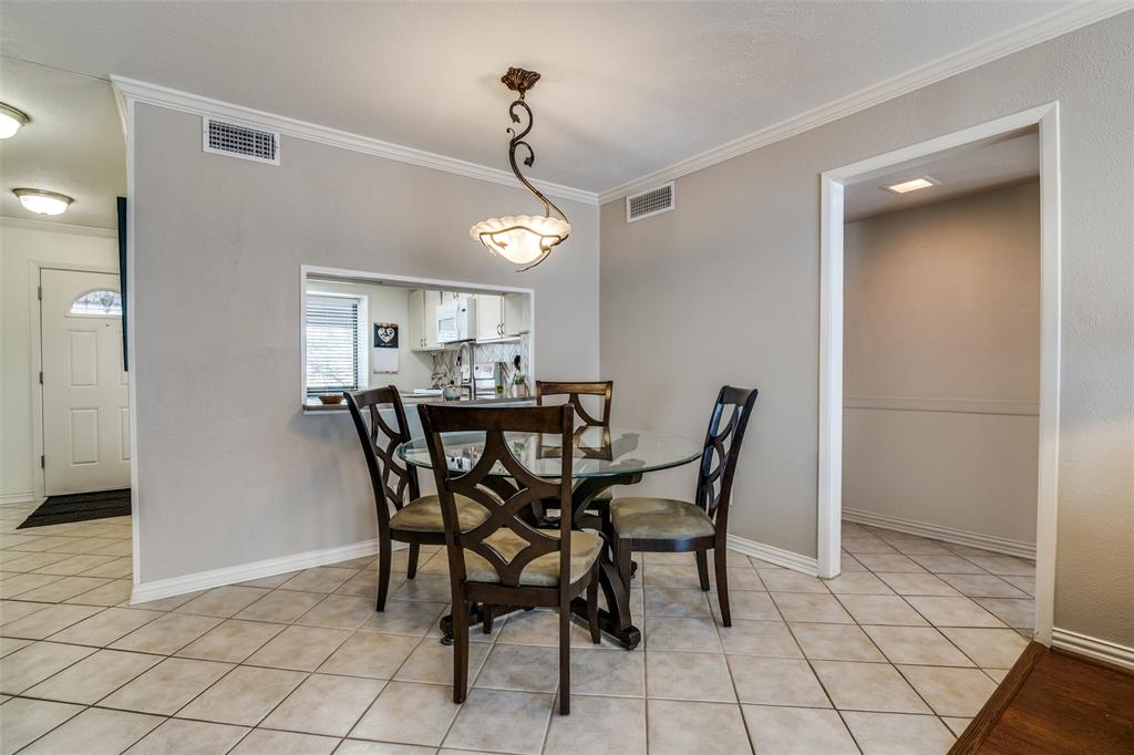 4559 North O'Connor Road, Unit 2289 Irving, TX 75062 - Photo 5 of 23 Dining room with ornamental molding, light tile patterned floors, and baseboards