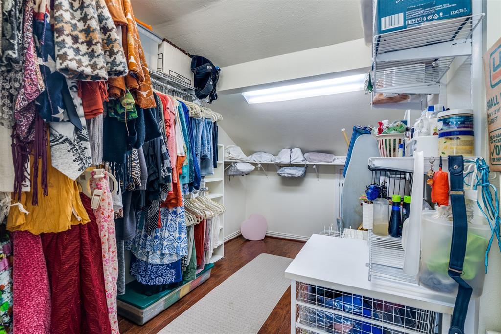 4559 North O'Connor Road, Unit 2289 Irving, TX 75062 - Photo 8 of 23 Primary 2nd floor bedroom walk in closet featuring wood finished floors