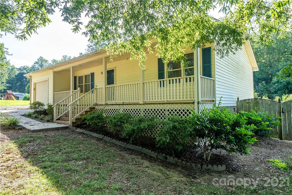 8623 Smith Road Stanfield, NC 28163 - Photo 1 of 27 a view of a garden in front of a house