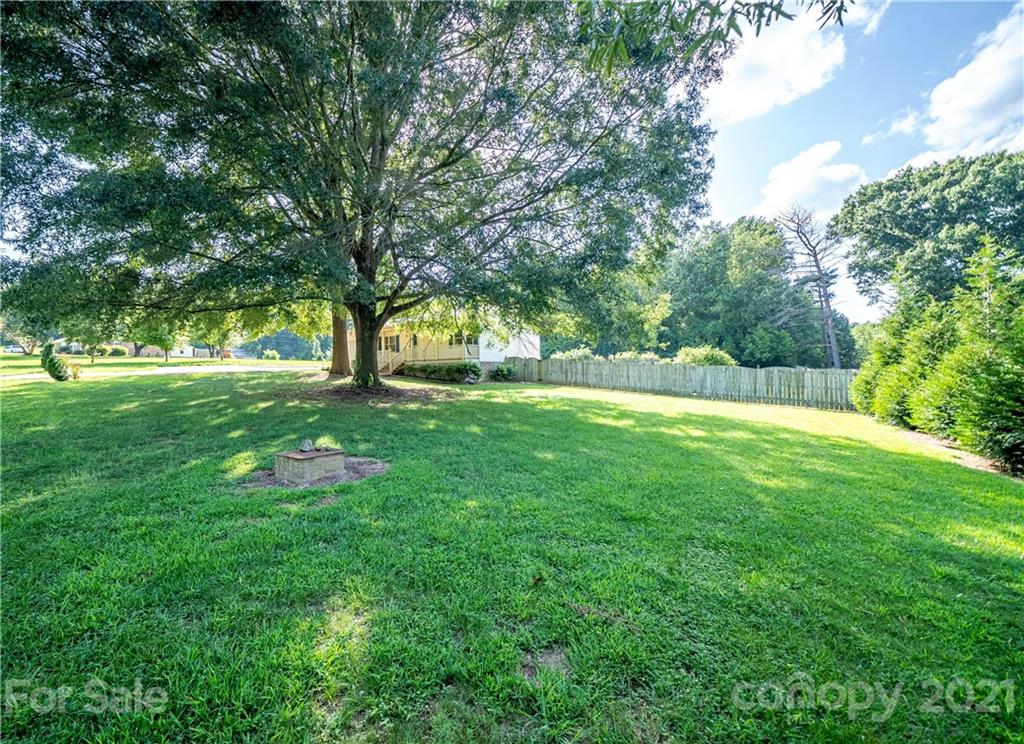 8623 Smith Road Stanfield, NC 28163 - Photo 2 of 27 a view of garden with trees