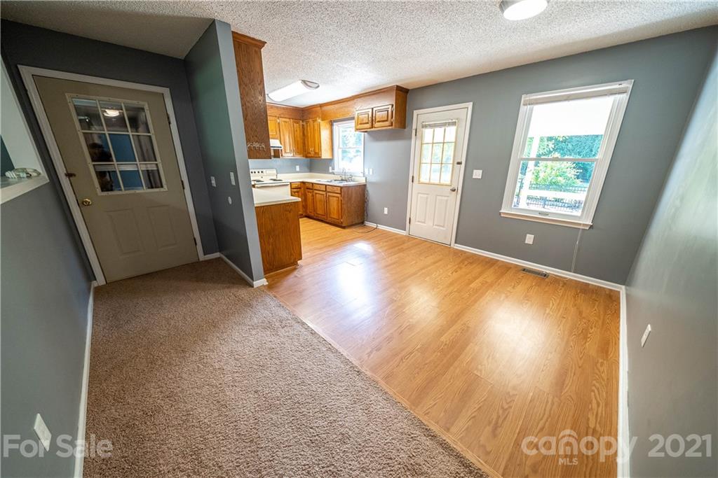8623 Smith Road Stanfield, NC 28163 - Photo 17 of 27 a view of a kitchen with furniture and a kitchen