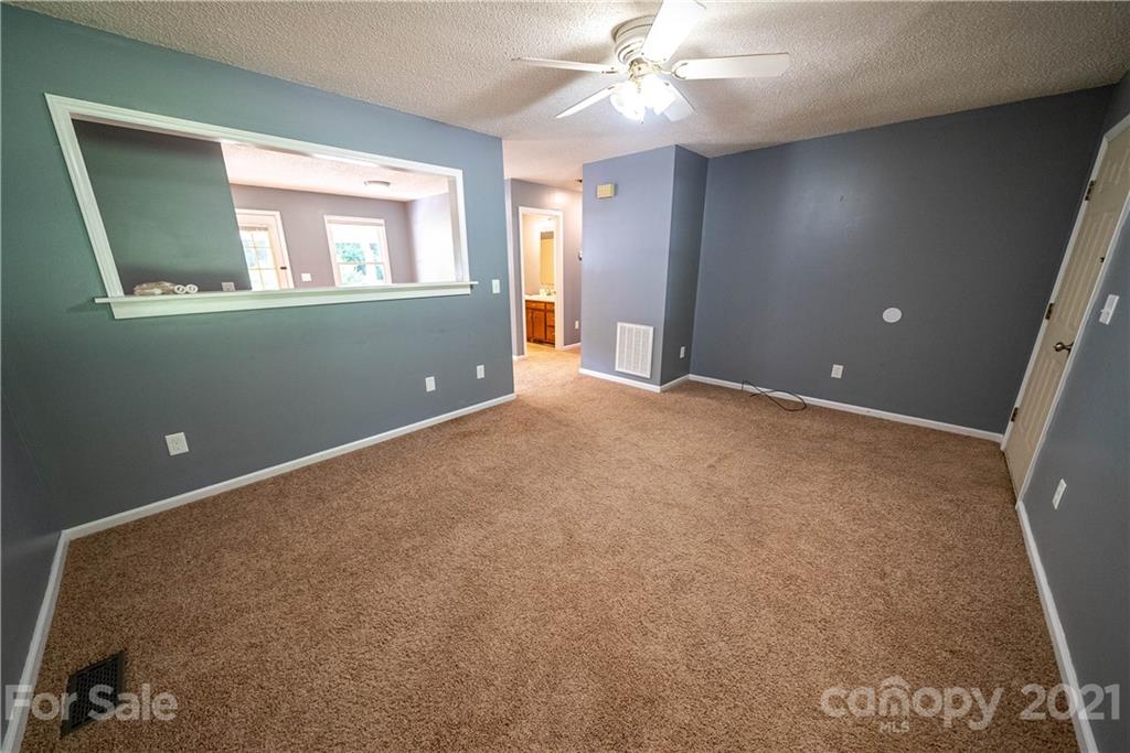 8623 Smith Road Stanfield, NC 28163 - Photo 20 of 27 a view of an empty room with a window