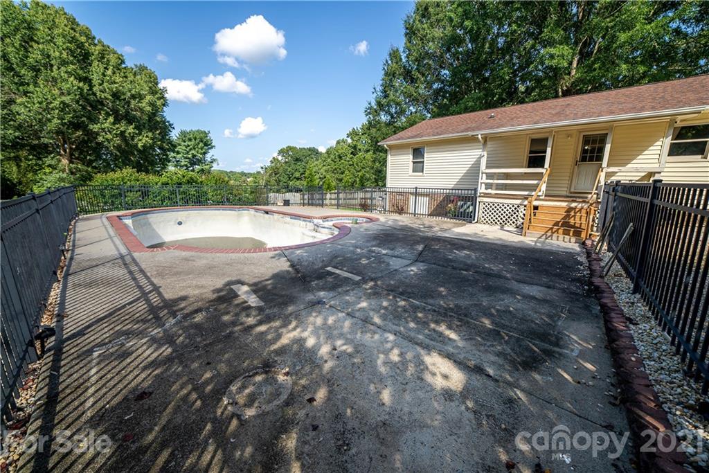 8623 Smith Road Stanfield, NC 28163 - Photo 5 of 27 a view of a house with a backyard and a tree