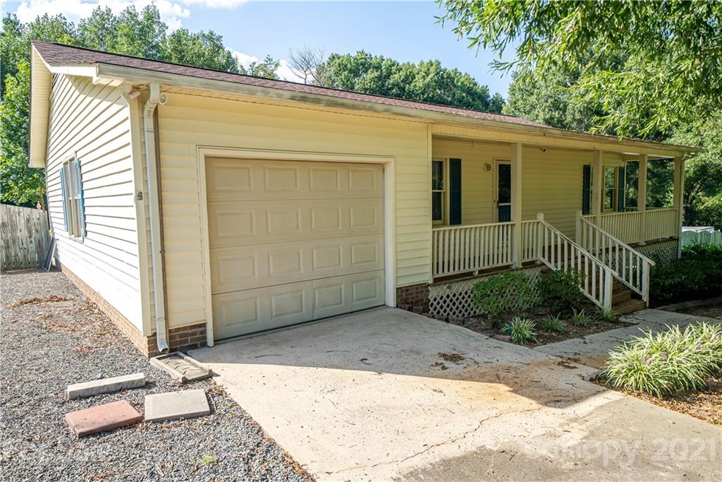 8623 Smith Road Stanfield, NC 28163 - Photo 6 of 27 a view of backyard with small cabin and wooden fence