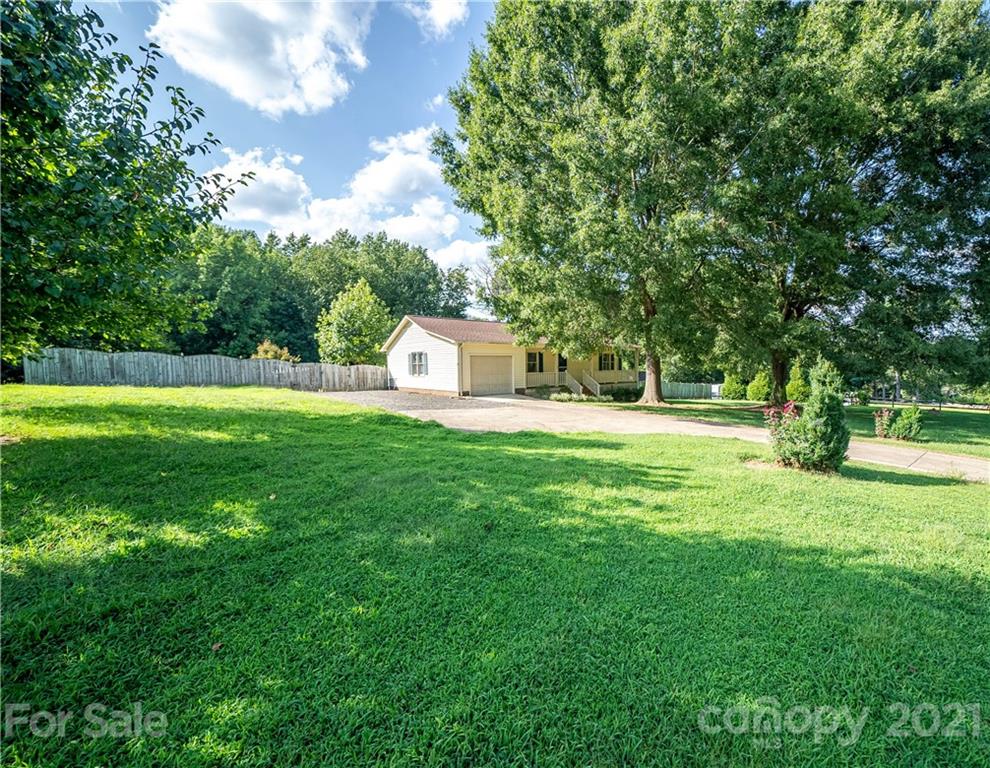 8623 Smith Road Stanfield, NC 28163 - Photo 9 of 27 a view of garden with trees and grass