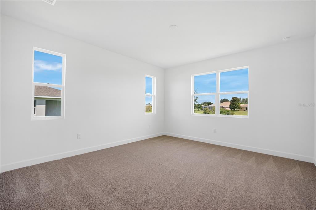 9196 Players Drive Weeki Wachee, FL 34613 - Photo 20 of 29 an empty room with windows