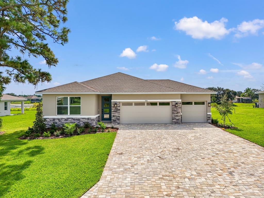 9196 Players Drive Weeki Wachee, FL 34613 - Photo 2 of 29 a front view of house with yard and green space