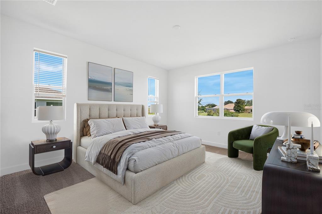 9196 Players Drive Weeki Wachee, FL 34613 - Photo 21 of 29 a bedroom with a bed and a couch