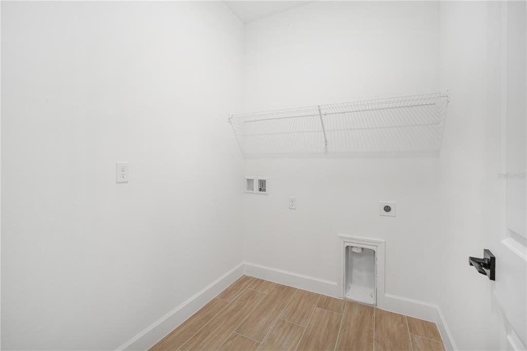 9196 Players Drive Weeki Wachee, FL 34613 - Photo 22 of 29 a view of a room with wooden floor