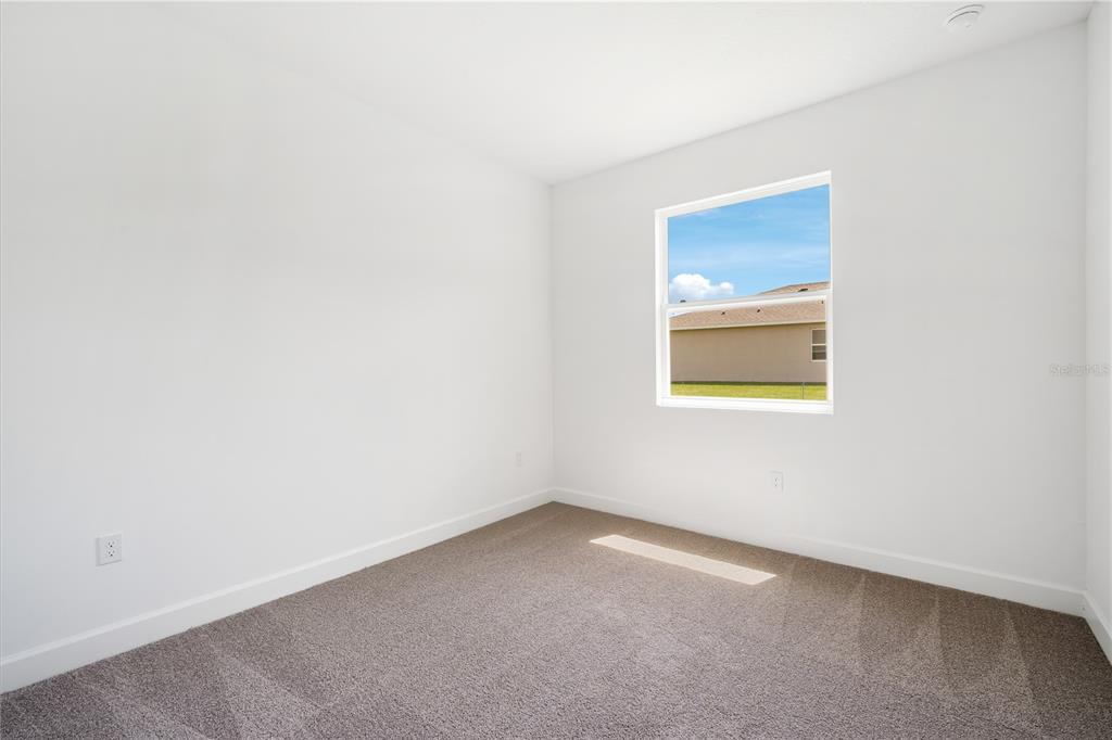 9196 Players Drive Weeki Wachee, FL 34613 - Photo 23 of 29 a view of an empty room