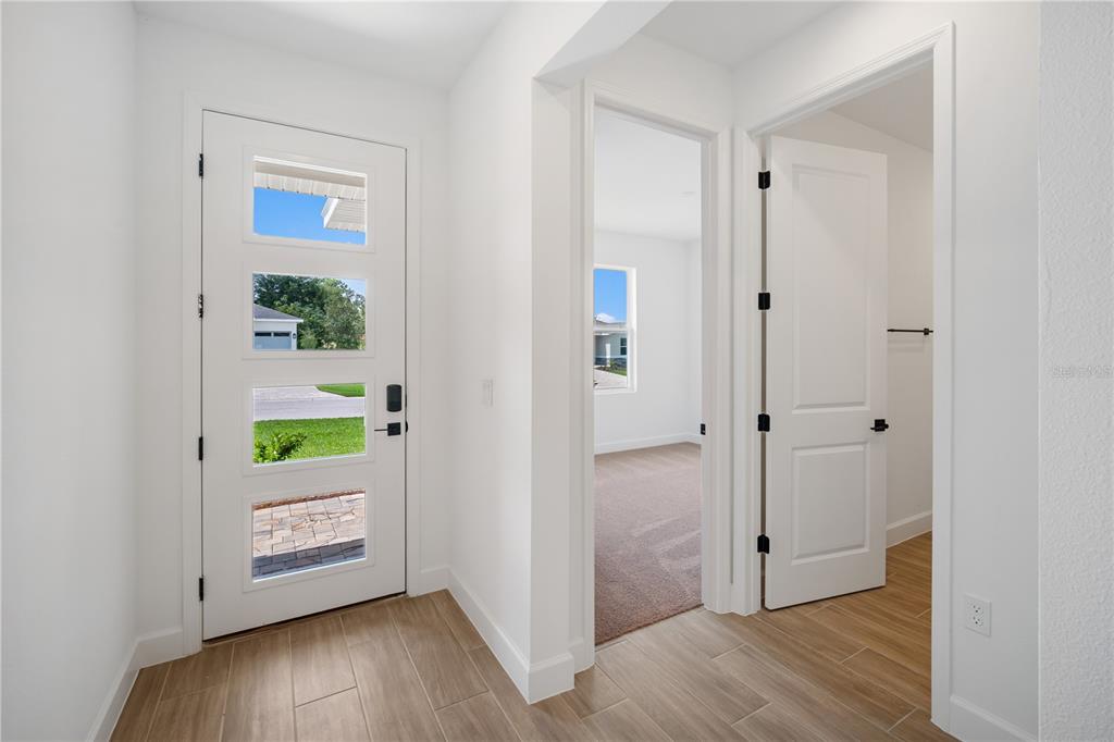 9196 Players Drive Weeki Wachee, FL 34613 - Photo 5 of 29 a view of an empty room and wooden floor